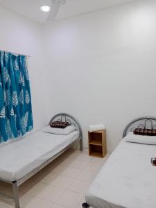 Homestay Desa Manjung Point, 437客房内的一张或多张床位