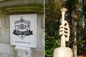 鲁汶Trumpet House的竖琴家的雕像和竖琴家的雕像