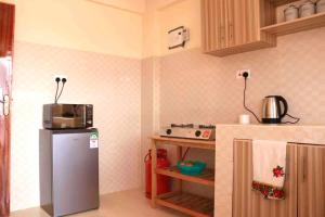 Cosy and spacious apartment in Meru的厨房或小厨房