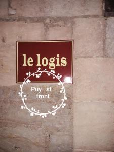 佩里格Le Logis du puy ST FRONT gite urbain PÉRIGUEUX的一块砖墙上的标志,上面写着一个写着“罗布”的字样