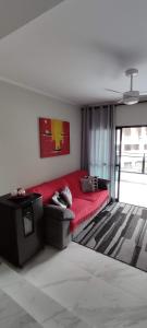 Apartamento Guarujá Astúrias客房内的一张或多张床位