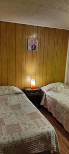 Hostal Del Tuto客房内的一张或多张床位