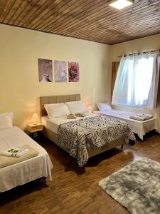 Hospedaria Paiol客房内的一张或多张床位