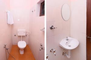 埃尔讷古勒姆PPG HOMES的白色的浴室设有卫生间和水槽。