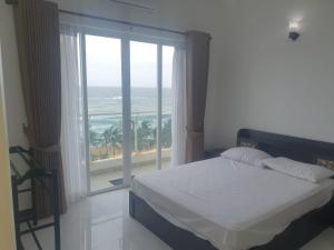 Beach Mount Apartment (Blue Ocean Apartment)客房内的一张或多张床位