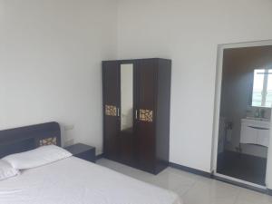 Beach Mount Apartment (Blue Ocean Apartment)客房内的一张或多张床位