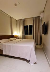Salinas Exclusive Resort - Apto 1Q客房内的一张或多张床位