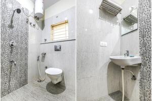 班加罗尔FabHotel RMS Comforts Yeshwantpur的带淋浴、卫生间和盥洗盆的浴室