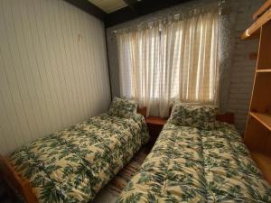 Cabañas Patagonia LicanRay客房内的一张或多张床位