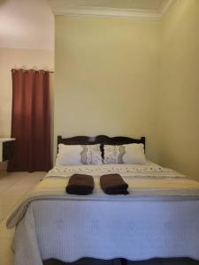 NusaTuah Roomstay客房内的一张或多张床位