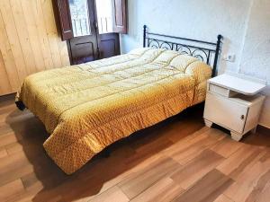 Cal Magí Casa de ubicación ideal en el Pirineo客房内的一张或多张床位