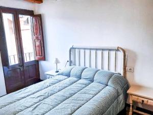 Cal Magí Casa de ubicación ideal en el Pirineo客房内的一张或多张床位