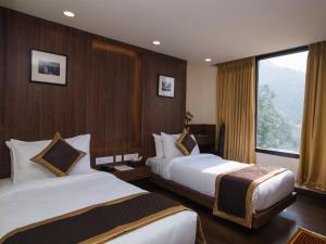 Indra Mandala,Gangtok - AM Hotel Kollection客房内的一张或多张床位