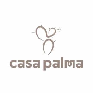 圣米格尔-杜戈斯托苏Casa Palma的加有casa Palilica字的casa Palilica标志