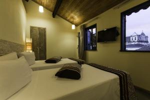 巴西亚咖啡酒店客房内的一张或多张床位