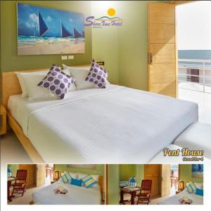 长滩岛长滩岛海滨时光酒店的一间卧室设有一张大床,享有海景