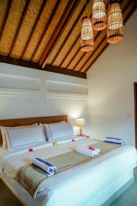 Marygio Gili Resort客房内的一张或多张床位