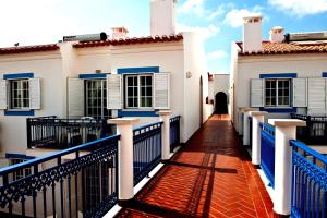 米尔芳提斯城Patios Da Vila Boutique Apartments by AC Hospitality Management的相册照片