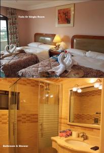 亚喀巴Mas-wadi的酒店客房设有两张床和盥洗盆