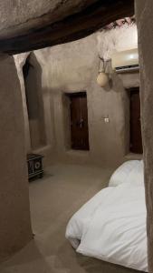 نزل حارة المسفاة Harit AL Misfah Inn客房内的一张或多张床位