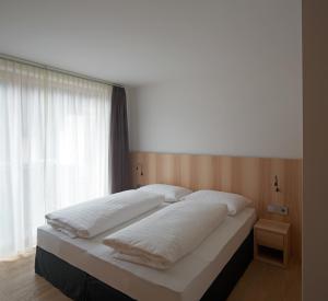 拉尔西乌内公寓式酒店客房内的一张或多张床位