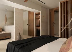 阿德里安诺斯坎波斯The Syntopia Hotel - Adults Only的卧室配有黑白床和衣柜。