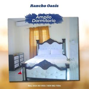 HigueyRancho Oasis, Residencial Sanate的一张带床的卧室的框架照片