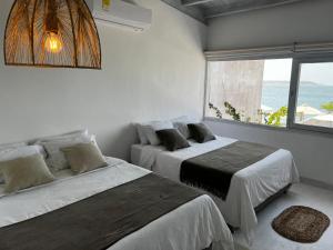 卡塔赫纳Wala beach club的海景客房 - 带两张床