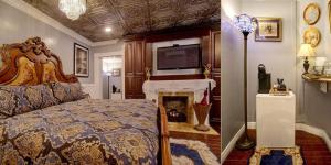 萨凡纳麦克米兰旅馆 的一间卧室配有一张床和一个壁炉及电视