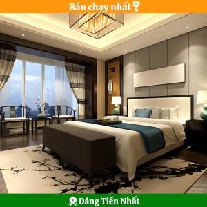 岘港Phuc Thanh Luxury Hotel by THG的一间带特大号床的卧室和一间客厅