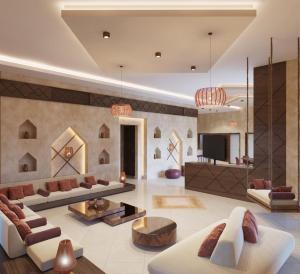 BuqayqSidra Resort的客厅配有两张沙发和一台电视机