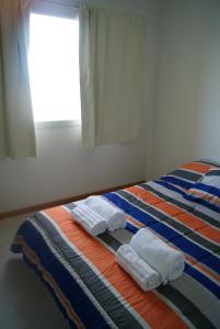珊瑚德马德林港公寓客房内的一张或多张床位