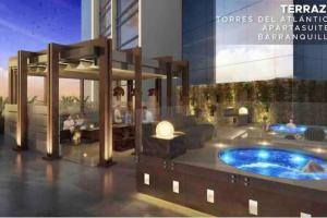 巴兰基亚Rams apartasuits en hotel 5 estrellas的一座带热水浴缸的建筑的 ⁇ 染