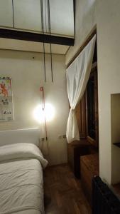 Appartamento Torre della Buca客房内的一张或多张床位