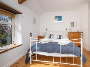 Primrose Cottage客房内的一张或多张床位