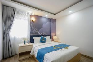 Moonlight Nha Trang Hotel客房内的一张或多张床位