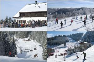 拉莎贝尔Les Gites de l étang :Studio à 20 mn de Gerardmer的一群人沿着雪覆盖的斜坡滑雪