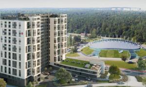 格丁尼亚Apartamenty BRUNO i BIANCA w Symphony Modern Tower Gdynia 2 i 3 piętro的两座建筑物和一个体育场的空中景观