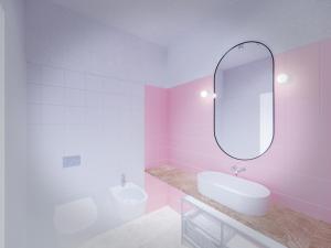 夸尔图-圣埃莱娜Spacebility Beach - self check-in的粉红色的浴室设有水槽和镜子