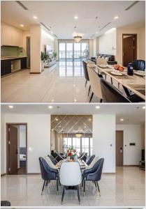 胡志明市The Landmark Vinhomes-Service Apartment的厨房以及带桌椅的用餐室。