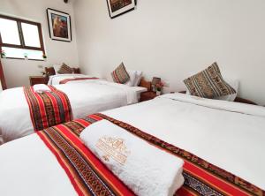 House Cusco客房内的一张或多张床位