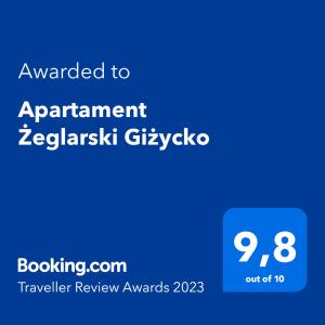 吉日茨科Apartament Żeglarski Giżycko的蓝色的屏幕,文字被授予了一致的泽布利斯基格