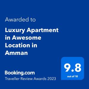 安曼Luxury Apartment in Awesome Location in Amman的一部手机的屏幕,手机的文本被授予豪华公寓,位置很棒