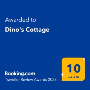 萨尔蒂Dino's Cottage的黄色标志,表示被授予迪诺咖啡