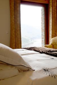 多佩哥乡村酒店客房内的一张或多张床位