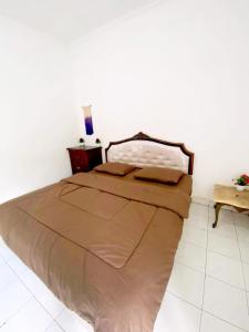 Emeralda Villa Puncak Resort客房内的一张或多张床位