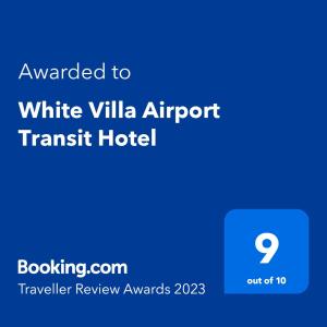 卡图纳耶克White Villa Airport Transit Hotel的白色别墅机场中转酒店,其文字被授予白色