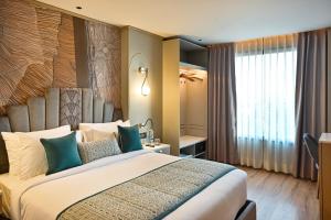 Parallel Hotel Udaipur - A Stylish Urban Oasis客房内的一张或多张床位