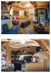 拉瓦勒La cabane du bon chemin ,spa的一间厨房和一个客厅,位于一个小房子里