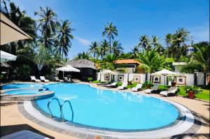 美奈Jaguar House Resort Muine的度假酒店的游泳池